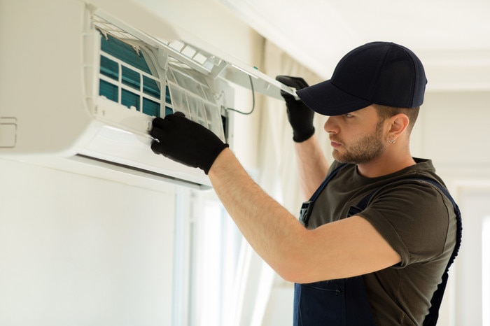 Technician installing an air filter